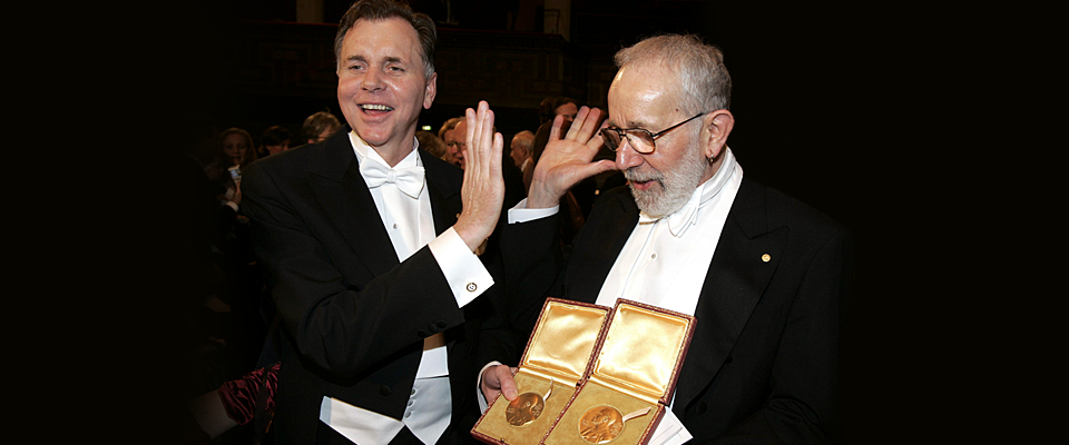 Marshall and Warren holding Nobel Prize medals