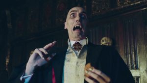 Vampire character in a Victorian suit, with pale skin and fangs