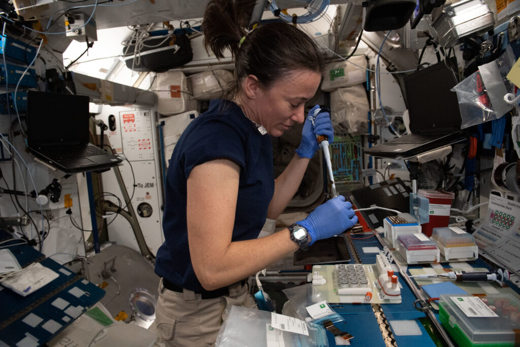 Astronaut Megan McArthur working on a protein growth experiment on the ISS.