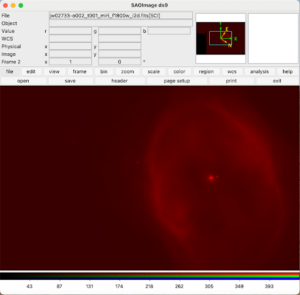 DS9 interface showing the red frame image of the Southern Ring Nebula. The nebula appears as a red blob with a central bright star on a darker red background