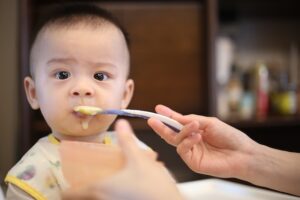 Baby being fed with a spoon