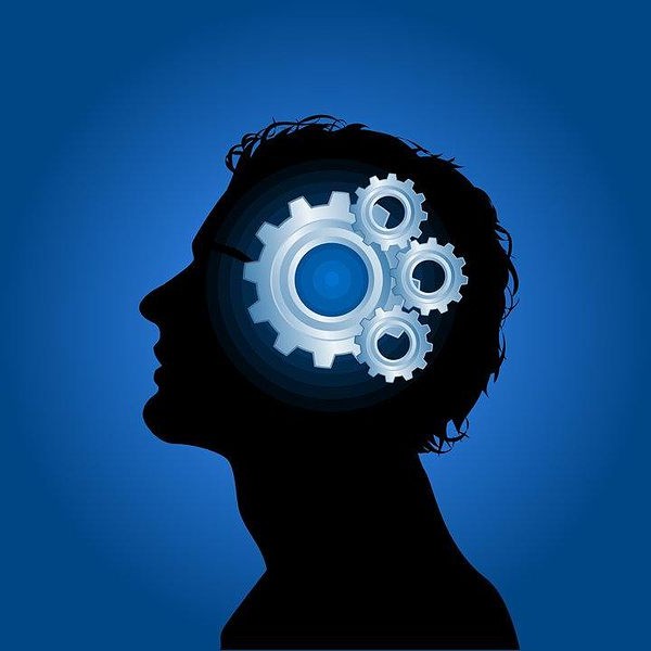 Abstract silhouette of person with gears overlaid to represent the brain.