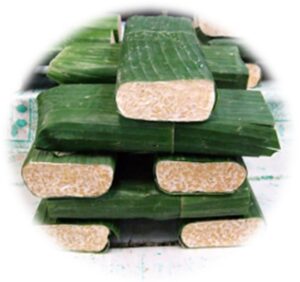 Cakes of tempeh wrapped in banana leaves